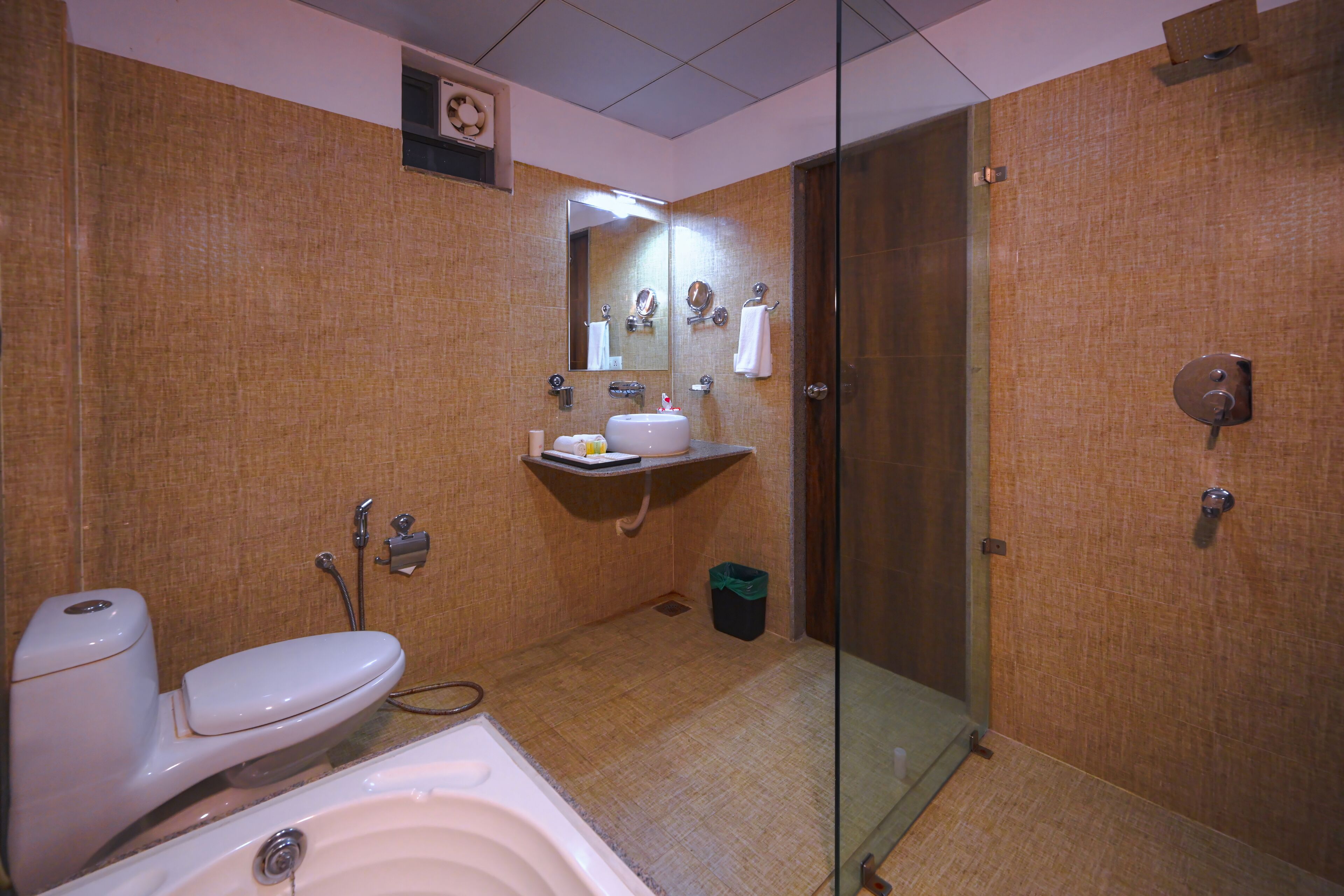 A bathroom with a toilet, sink, and bathtub.