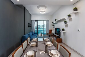Premium Apartment, 2 Bedrooms, Balcony | Living area | 36-inch flat-screen TV with digital channels, TV