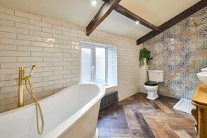 Bathtub, hair dryer, towels, soap