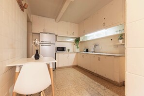 Microwave, coffee/tea maker, toaster, cookware/dishes/utensils