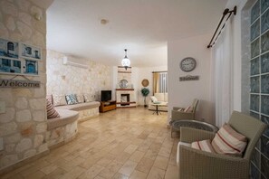 Flat-screen TV, fireplace, DVD player, ping pong