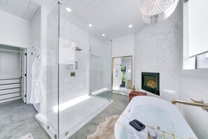Shower, hair dryer, towels, shampoo