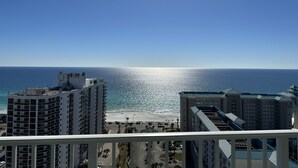 A high-rise building with a view of the ocean and beach. - Gorgeous Ocean and Bayside View (Miramar Beach)