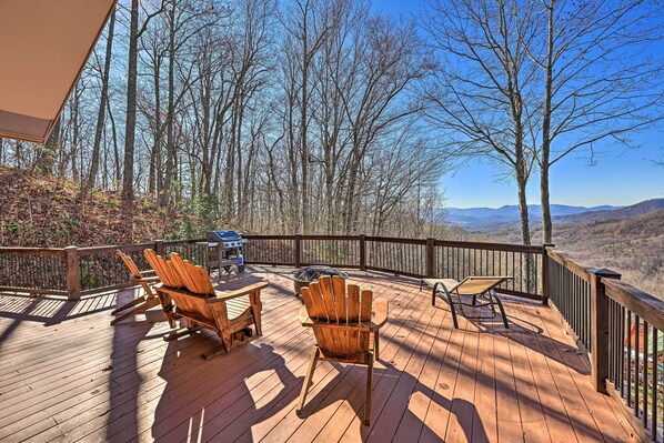 Relax on the deck with a grill and Adirondack chairs, taking in the breathtaking mountain views.