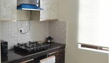 Fridge, cookware/dishes/utensils, dining tables