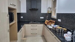 Fridge, microwave, cookware/dishes/utensils