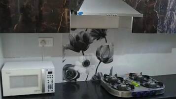 Fridge, cookware/dishes/utensils, dining tables