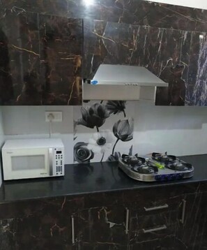 Fridge, cookware/dishes/utensils, dining tables