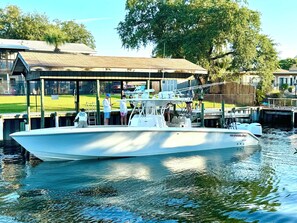 Moored at the marina, this boat offers a cabin and a deck area.