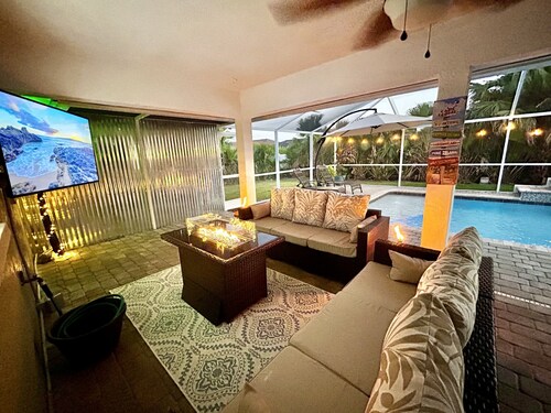 Tropical Oasis sleeps 13 with a heated pool.  Free WiFi.  Close to everything   