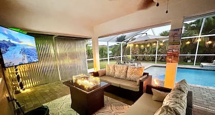 Tropical Oasis sleeps 13 with a heated pool. Free WiFi. Close to everything