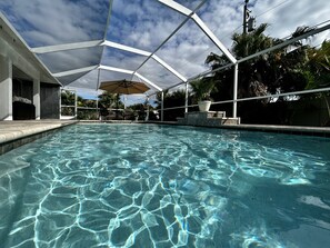 Outdoor pool, a heated pool - Tropical Oasis sleeps 13 with a heated pool. Free WiFi. Close to everything (Cape Coral)