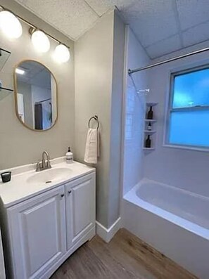 Bathtub, hair dryer, towels