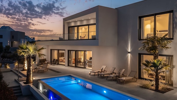 A modern two-story house with a swimming pool, outdoor seating, and large windows. - Luxury Villa Superstar with Pool (Vodice)