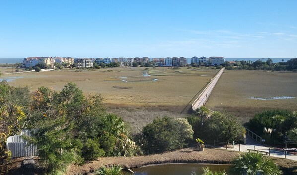 A coastal residential area with a long bridge connecting two parts of the property. - RENOVATED LUXURY BEACH VILLA,Ocean view,3 bdrms each with smart tv and king bed (Hilton Head Island)