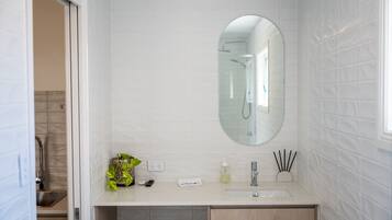 Bathtub, towels, soap, toilet paper