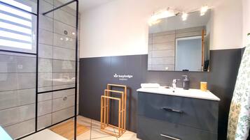 Bathtub, hair dryer, towels, soap