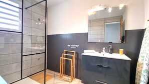 Bathtub, hair dryer, towels, soap