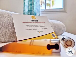 Bathtub, hair dryer, towels, soap