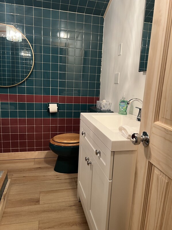 View from door of 2nd floor full bathroom at the top of the stairs 