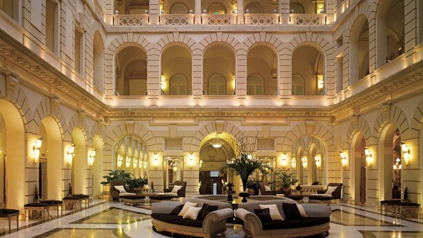 A grand lobby with a central seating area, arched ceilings, and a second-floor balcony. - If you Like it, Stay If you Dont Like it, Just Stay (Hanoi)
