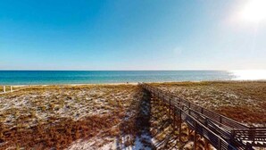 A beach with a wooden walkway leading to the water. - Southern Jewel 1 Bedroom | 1.5 Baths | Sleeps 4 (Navarre Beach)