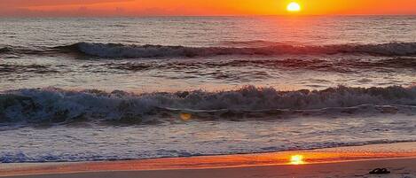 On the beach, sun loungers, beach towels