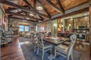 Enjoy meals in the dining area with a large table and comfortable seating.