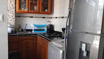 Fridge, stovetop, coffee/tea maker, electric kettle