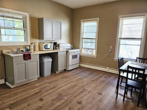Fridge, microwave, coffee/tea maker, cookware/dishes/utensils