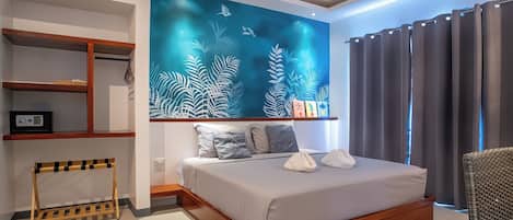 A modern bedroom with a bed, a ceiling fan, a wall-mounted shelf, and a large window with curtains.