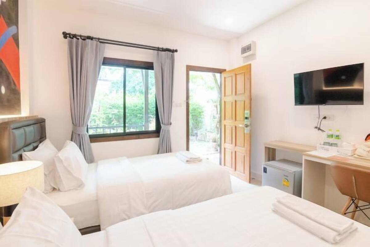 Premium bedding, desk, laptop workspace, blackout curtains