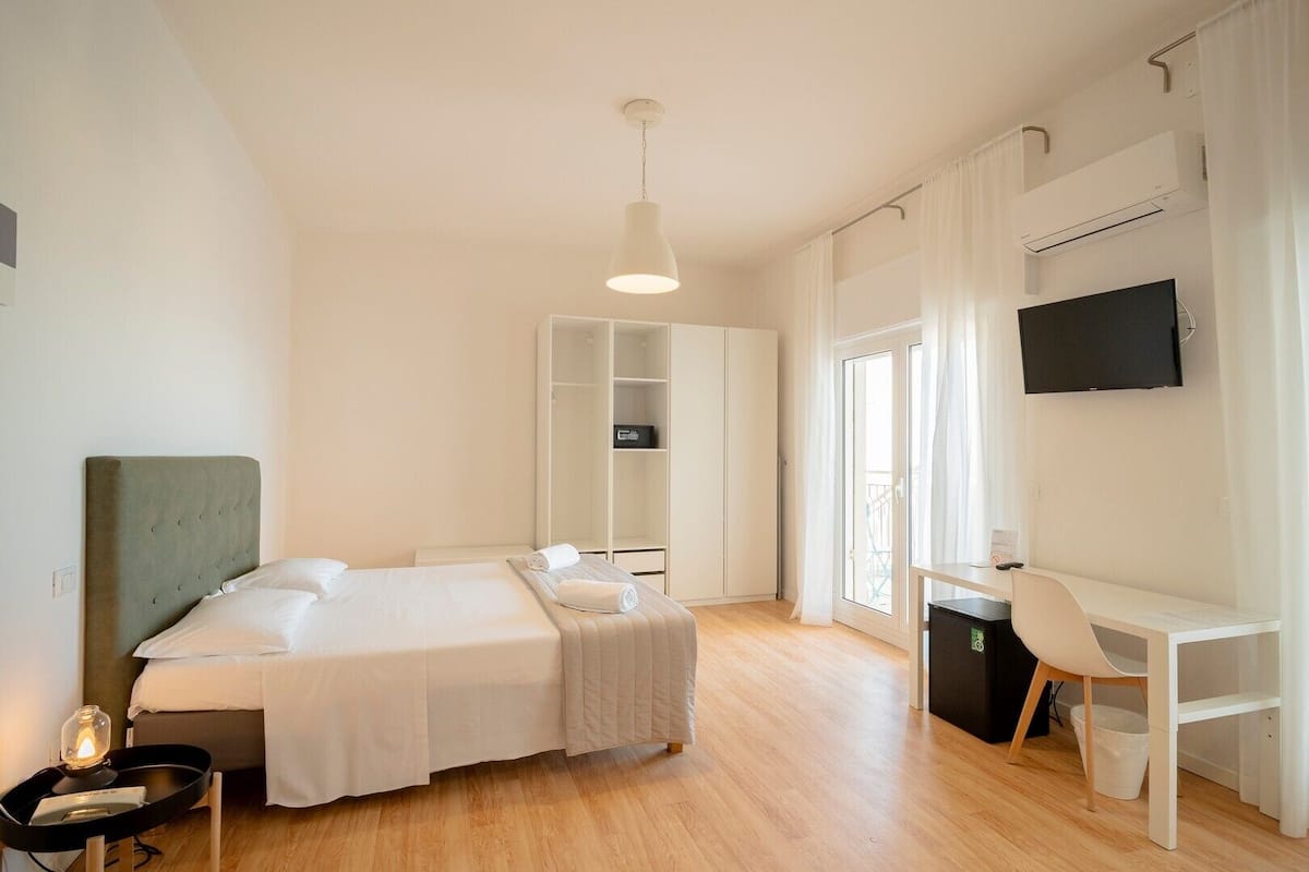 Quadruple Family Deluxe Room | In-room safe, desk, free WiFi, bed sheets