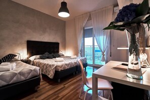 Deluxe Triple Room with partial sea view