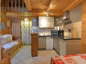 Fridge, stovetop, dishwasher, coffee/tea maker