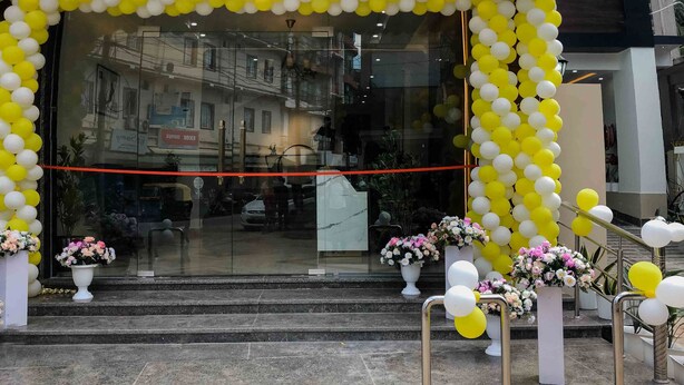 A hotel entrance with a sign reading "HOTEL GRAND LOTUS" and a decorative arch of yellow and white balloons. - Grand Lotus Dimapur (Dimapur)