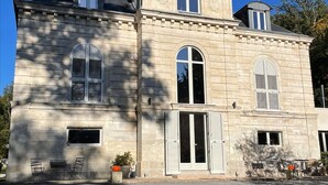 A two-story stone building with symmetrical windows and a central entrance. - Domaine de Bonneuil (Bonneuil-les-Eaux)