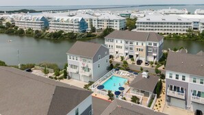 A residential area with a swimming pool surrounded by houses.