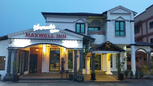 A two-story building with a sign reading "Maxwell Inn." - Capital O 90653 Maxwell Inn Boutique Hotel (Taiping)