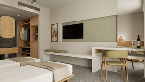 Une chambre d’hôtel moderne équipée d’un lit, d’un bureau, d’une chaise, d’une télévision, d’une armoire et d’un petit coin salon avec des coussins.