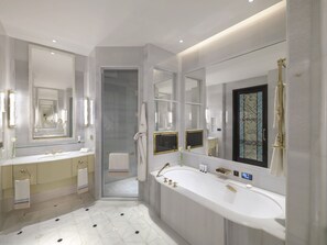 Deluxe Room With Garden, 1 King Bed | Bathroom | Deep soaking tub, designer toiletries, hair dryer, bathrobes