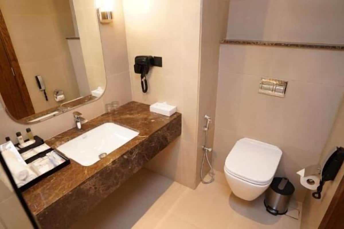 Bathroom | Rainfall showerhead, hair dryer, slippers, bidet