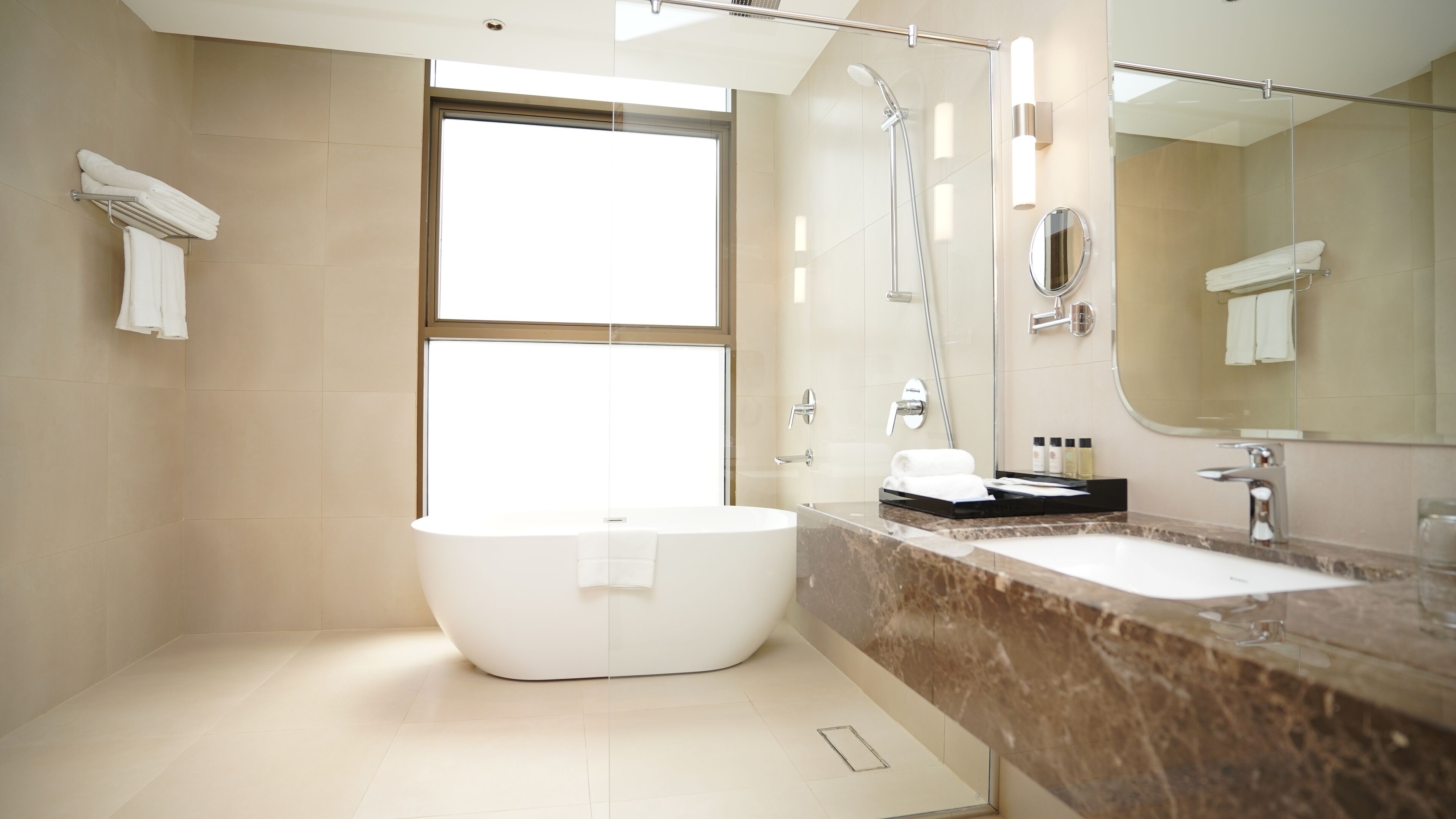 executive studio suite | bathroom | rainfall showerhead, hair dryer, slippers, bidet