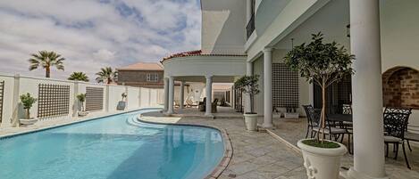 Outdoor pool, pool umbrellas, sun loungers