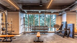 Work out in style with a variety of equipment and a view of palm trees.