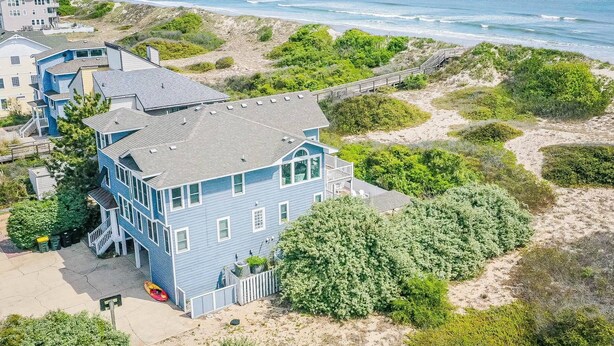 A coastal house with a large balcony overlooking the beach and ocean. - Make Lasting Memories at 'Memory Maker' | Pool, Hot Tub, Game Room | Perfect for Large Families (Corolla)