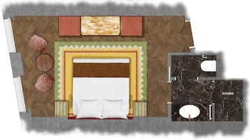 A hotel room layout with a bed, two seating areas, a shower, and a bathroom.