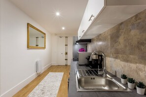 Fridge, microwave, stovetop, coffee/tea maker