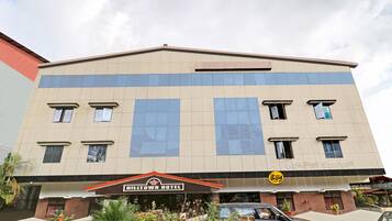 A two-story building with a sign for Hilltown Hotel.