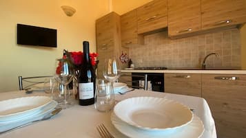 Family Condo | Private kitchen | Stovetop, cookware/dishes/utensils